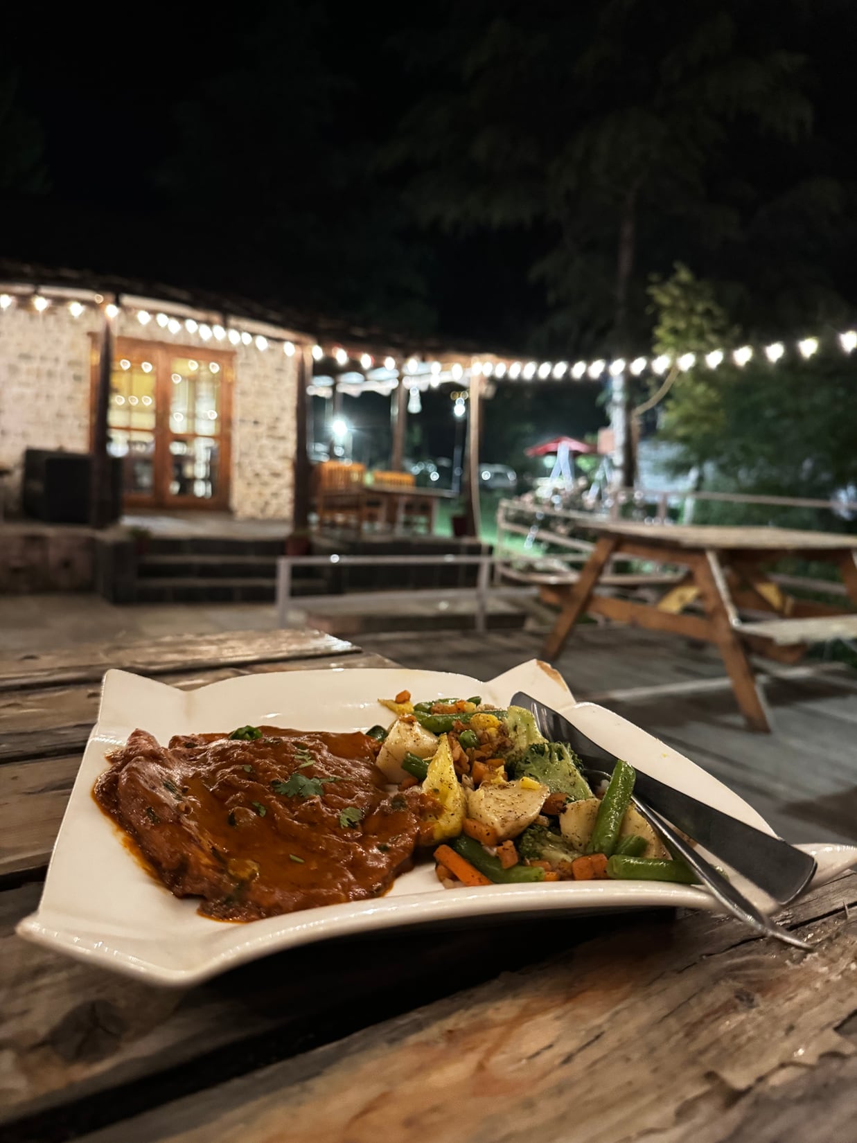 Dinner served on the riverside deck at WhiteStone Cottages